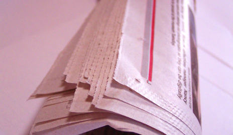 Rolled up newspaper used in priming the flue