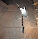 A bracket for a top sealing damper