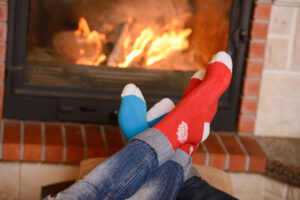 Feet in front of fireplace