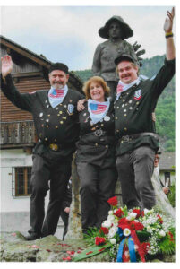 Rick, Terri and Kyle in chimney sweep uniforms in Santa Maria Maggiore, Italy