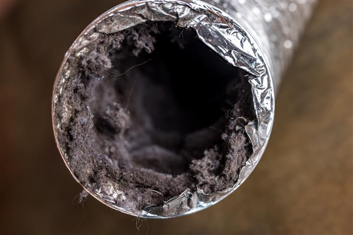 Dryer vent connector hose clogged with lint